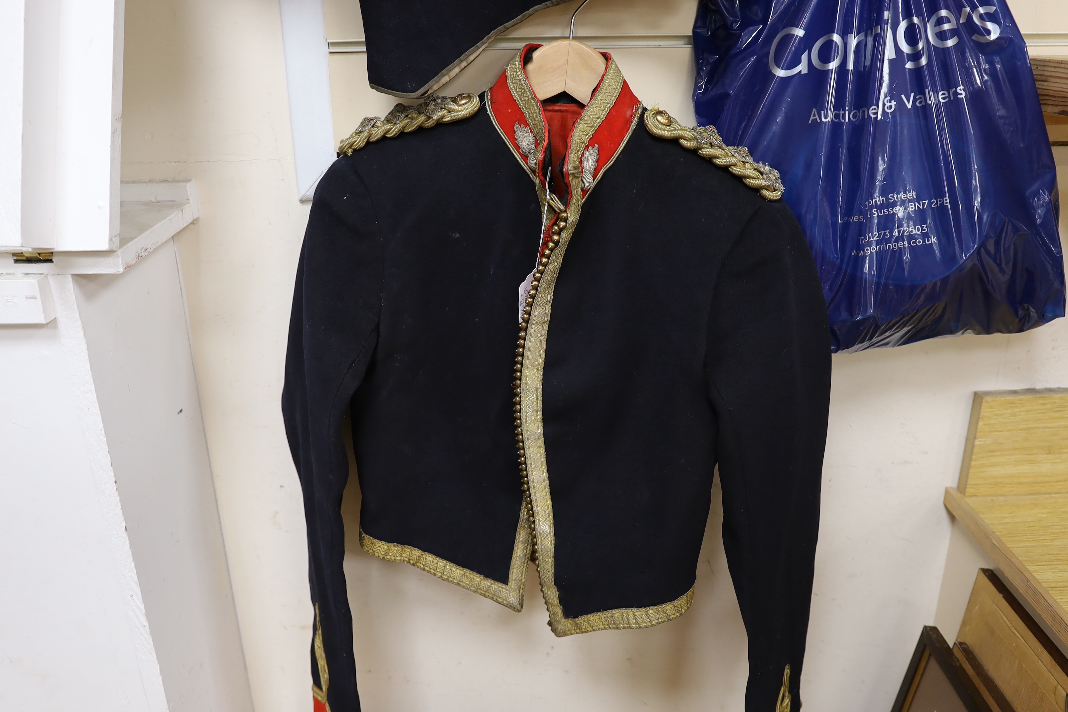 An early 20th century Royal Artillery officers dress uniform, comprising a jacket and trousers, both with original maker’s labels for J. Daniels and Co., with owner’s name ‘Major G.H. Tristram R.A.’ added in pen, a Mess